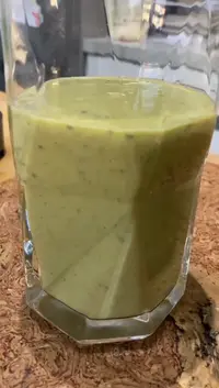 Moringa smoothie in a glass with mango and chia seeds, no banana